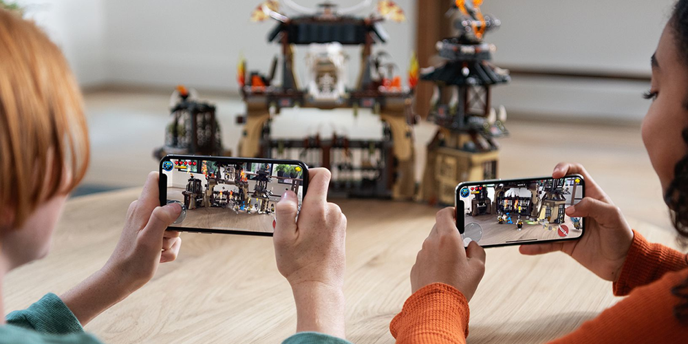 AR Mobile Gaming two woman with smartphones